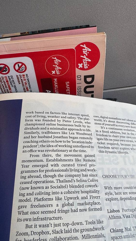 An open magazine page featuring an article about digital nomadism and remote work trends.