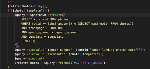 The image displays a code snippet written in PHP for querying a database of photos.
