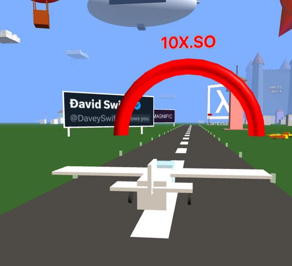 A virtual scene featuring a small airplane approaching a red fly-through ring on a runway.