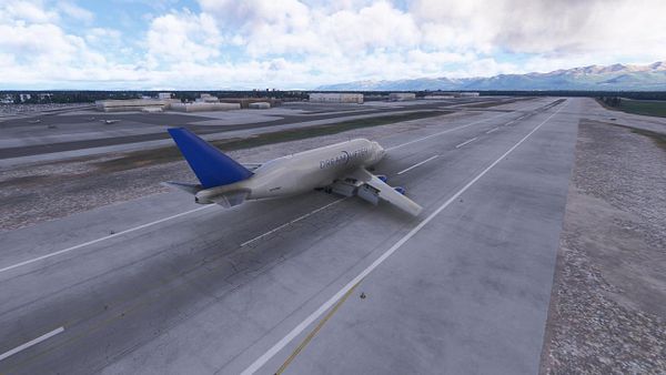 A Boeing 747 cargo plane is flying over Alaska with only one engine running.