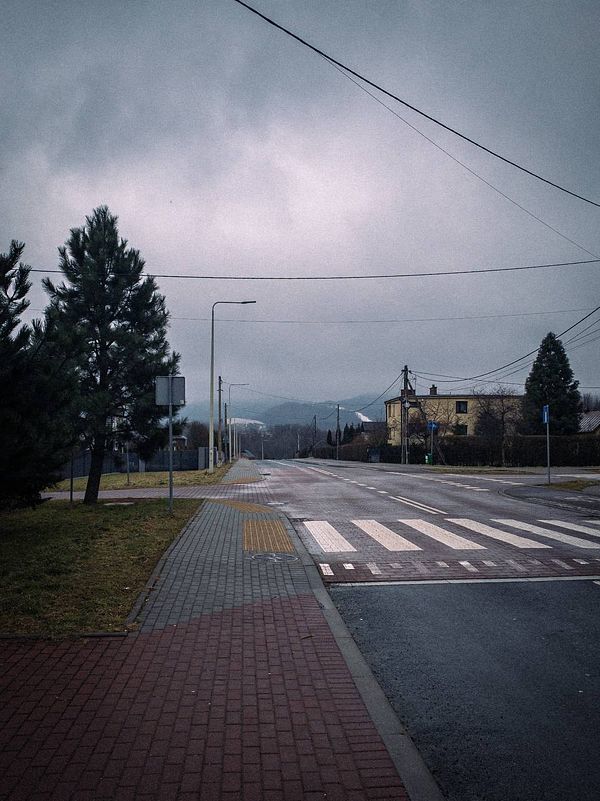 A quiet street scene on a cloudy morning, ideal for a walk.