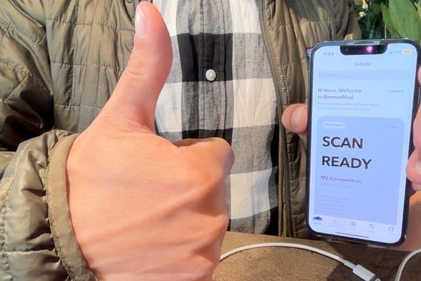 Screenshot of an iPhone displaying a BMW app installation screen with app metadata and install options.