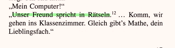 Top-down view of a person holding a smartphone displaying a language-learning app showing a German lesson screen.